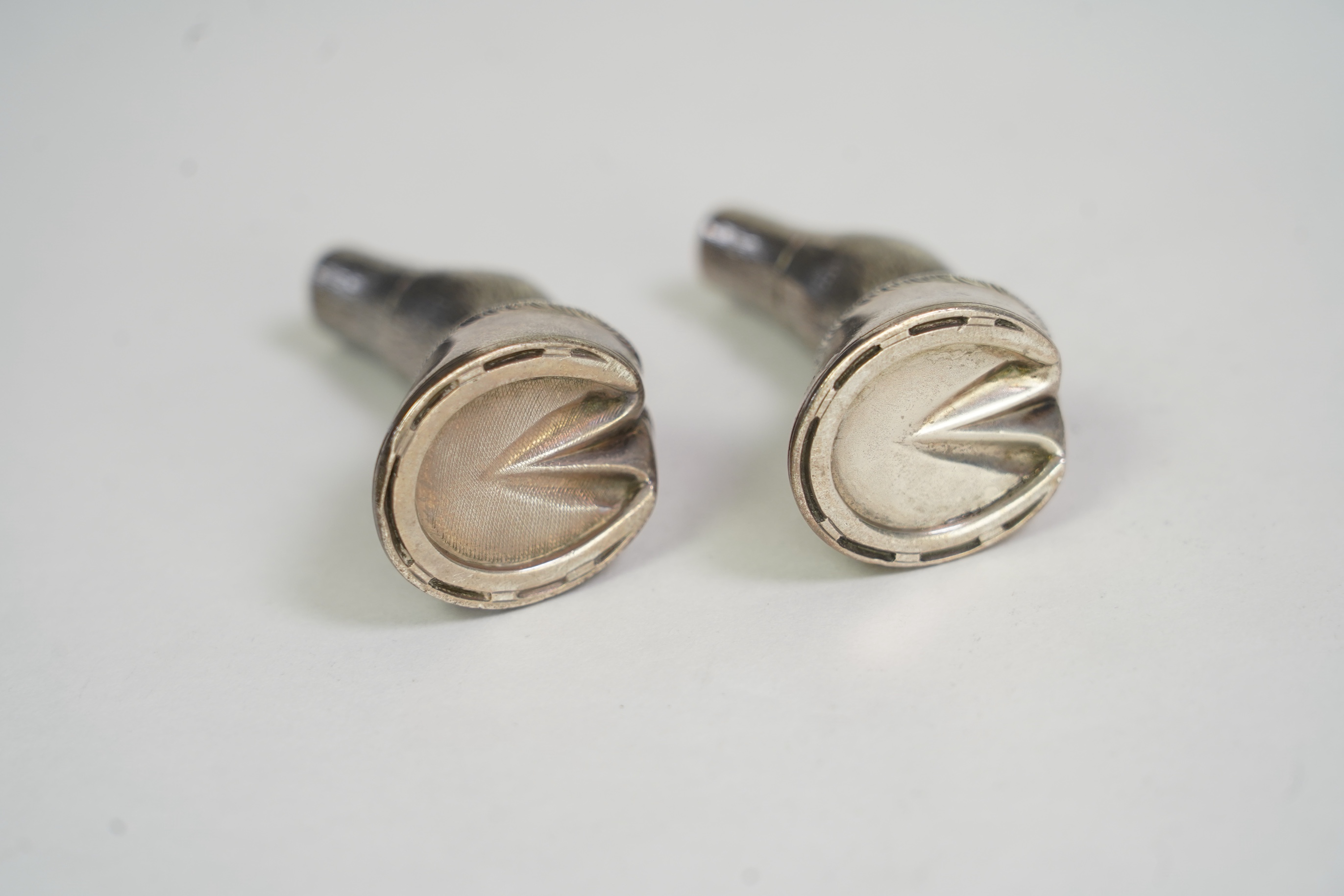 A pair of Edwardian novelty silver condiments modelled and a horse's fetlock and hoof, makers mark rubbed